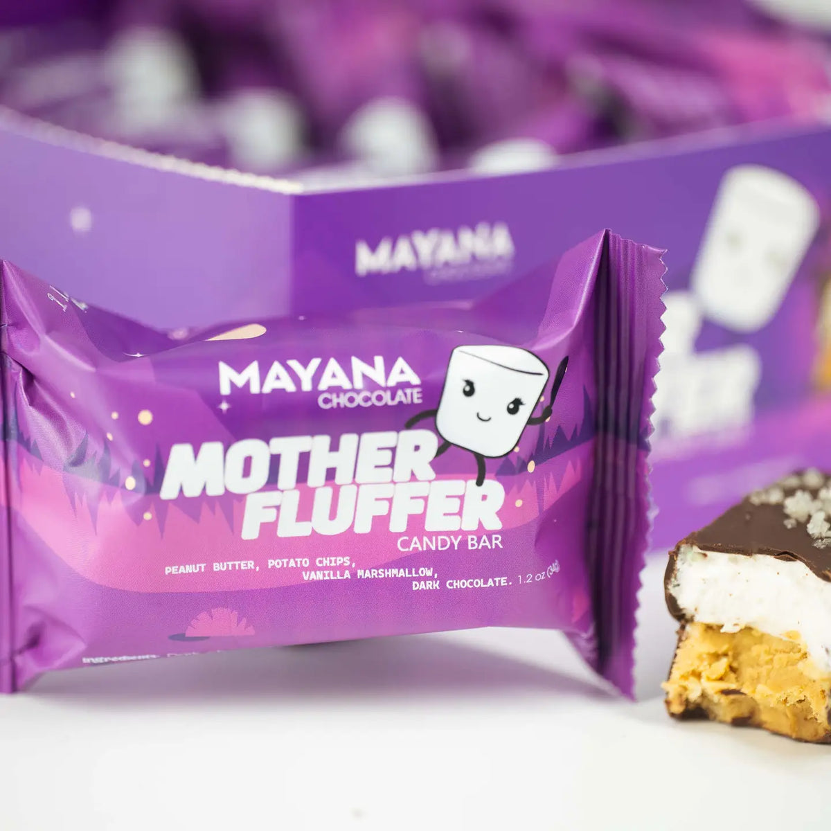 Mayana Mother Fluffer candy bar packaging with a bite taken out of it.