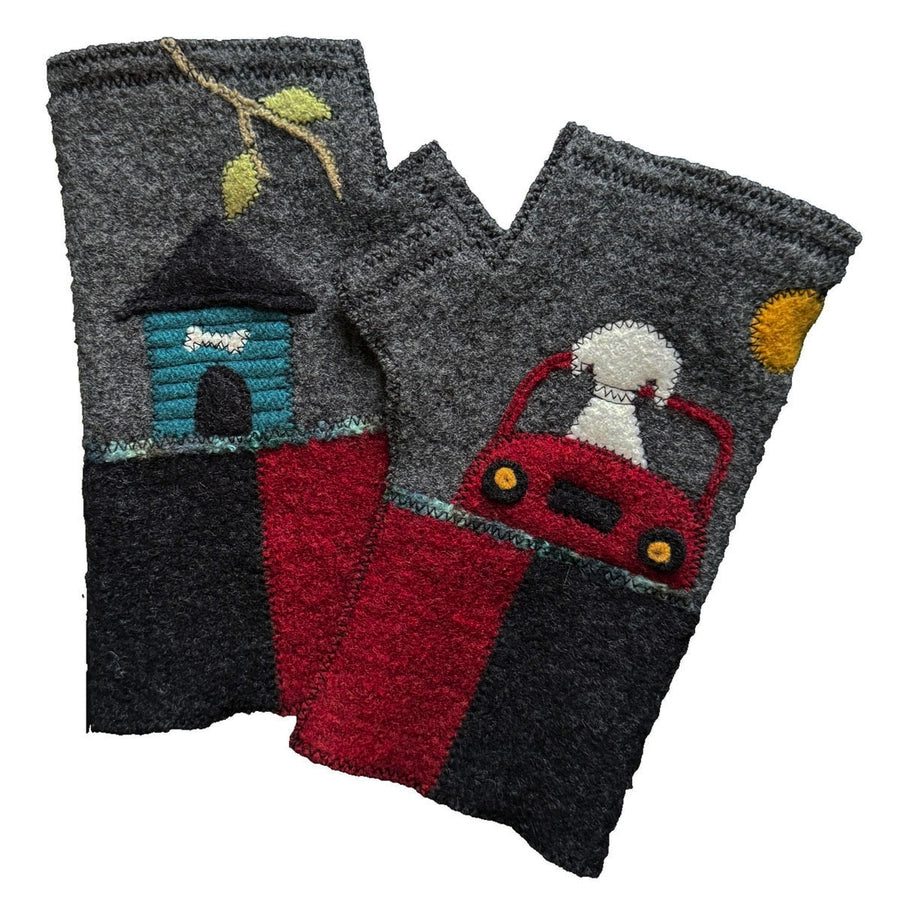 A pair of fingerless wool gloves with a red and black design, featuring a blue house, a white dog, and a red car embroidered on the back.