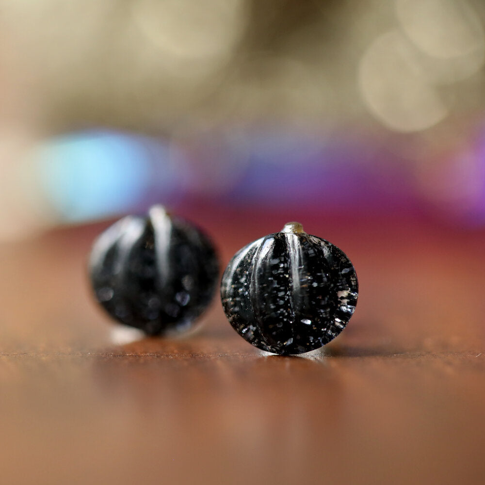 Black Pumpkin Earrings on Wood Surface