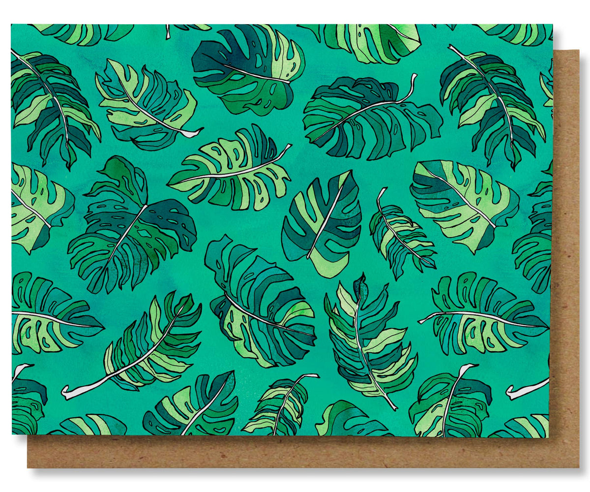 Box of 8 greeting cards with monstera leaves on a green background