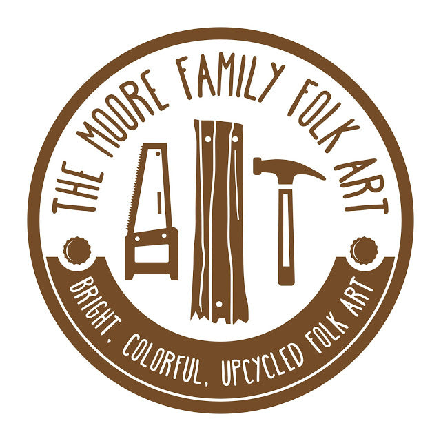 The Moore Family Folk Art Logo in a Circle with tools and reading bright. colorful. upcycled folk art. 