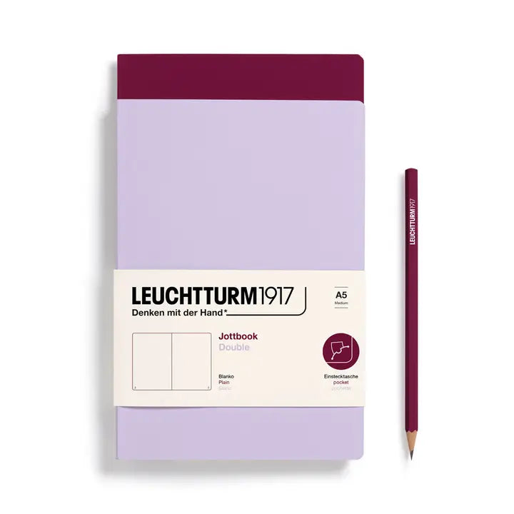 Leuchtturm1917 notebook two pack with a purple pencil on a white background