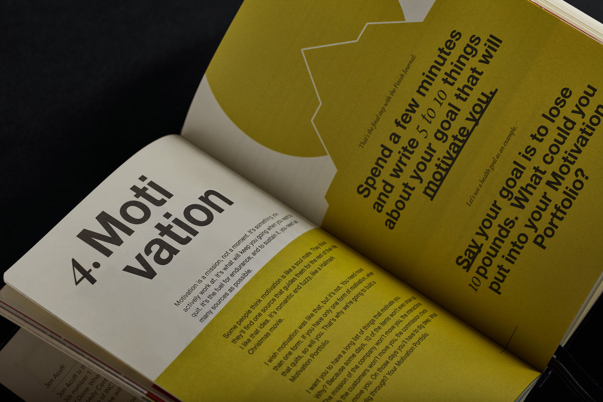 Open book with yellow and white pages on a dark background