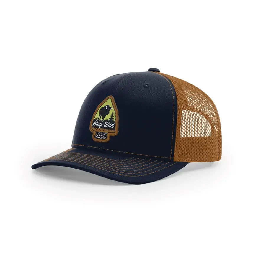 Navy and brown cap with mesh back and logo on a white background