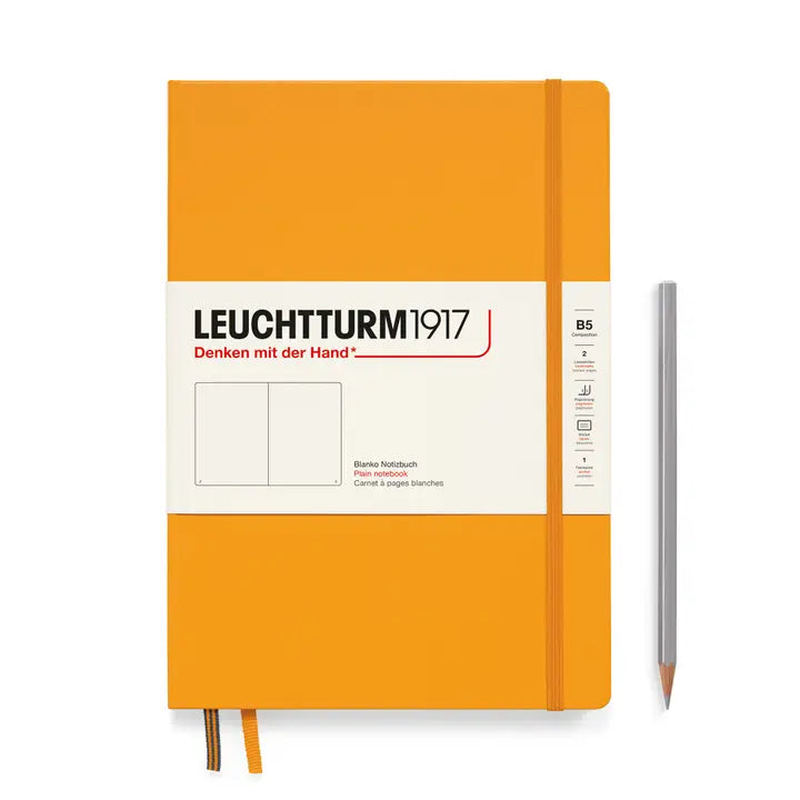Orange notebook with white label featuring 'Leuchtturm1917' on a white background
