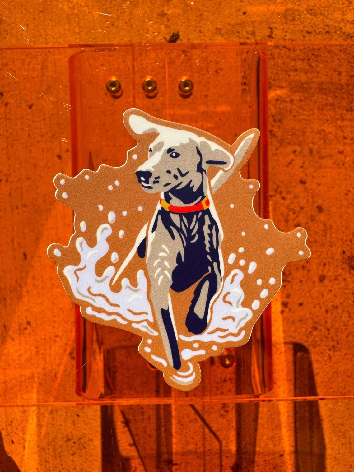 Dog illustration sticker on a wooden surface with an orange tint