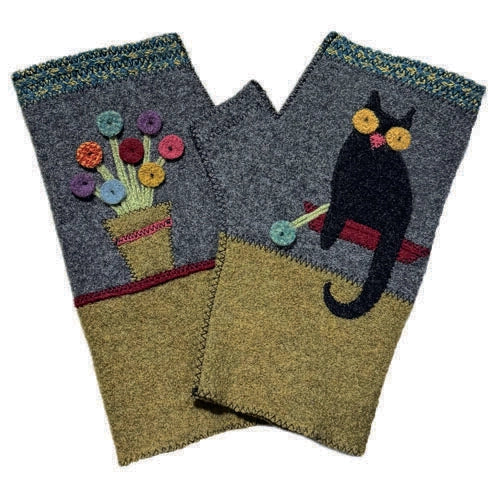 Pair of fingerless gloves with floral and cat designs on a white background