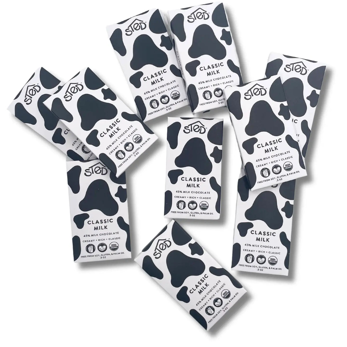 Multiple packages of Sted Food's Classic Milk chocolate bars on a white background