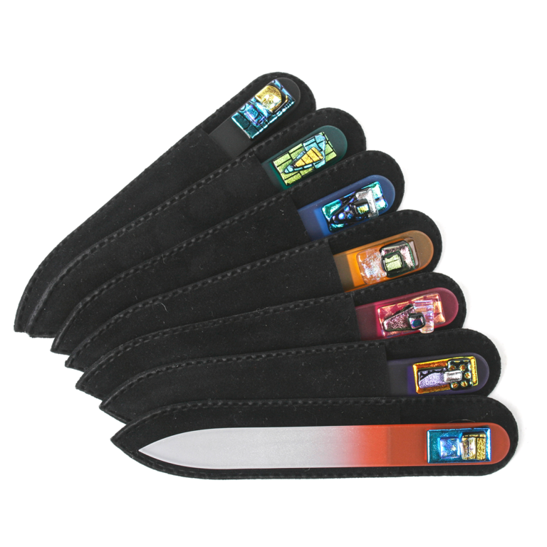 spread of glass nail files with black covers on a white background
