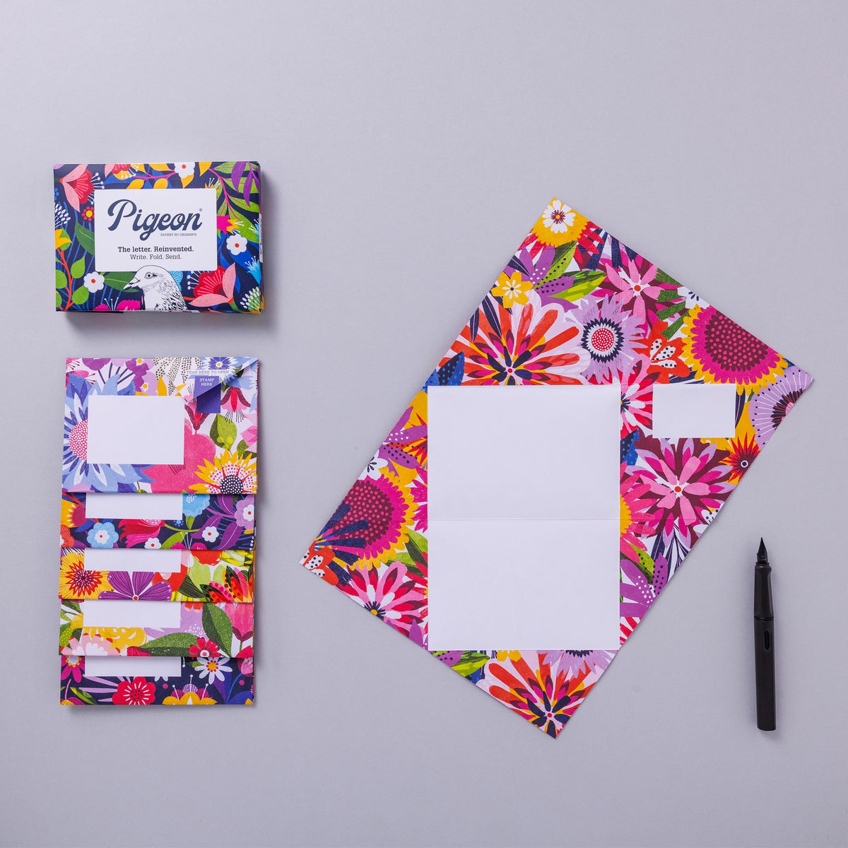 Colorful stationery set with floral design on a gray background