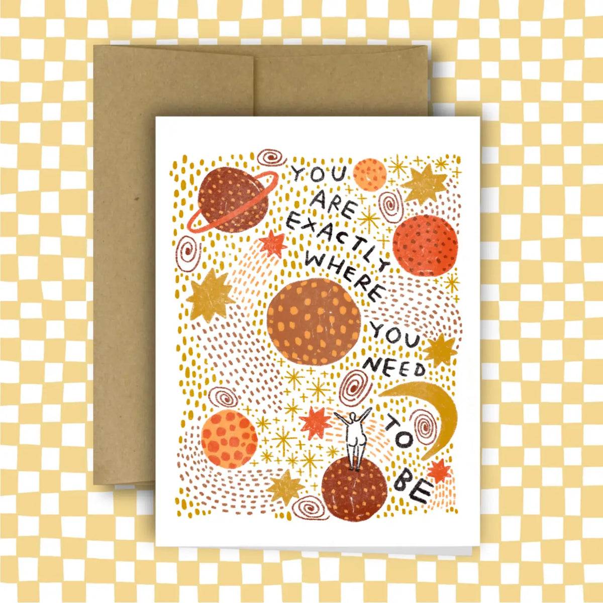 Greeting card with space-themed design and motivational text on a checkered background