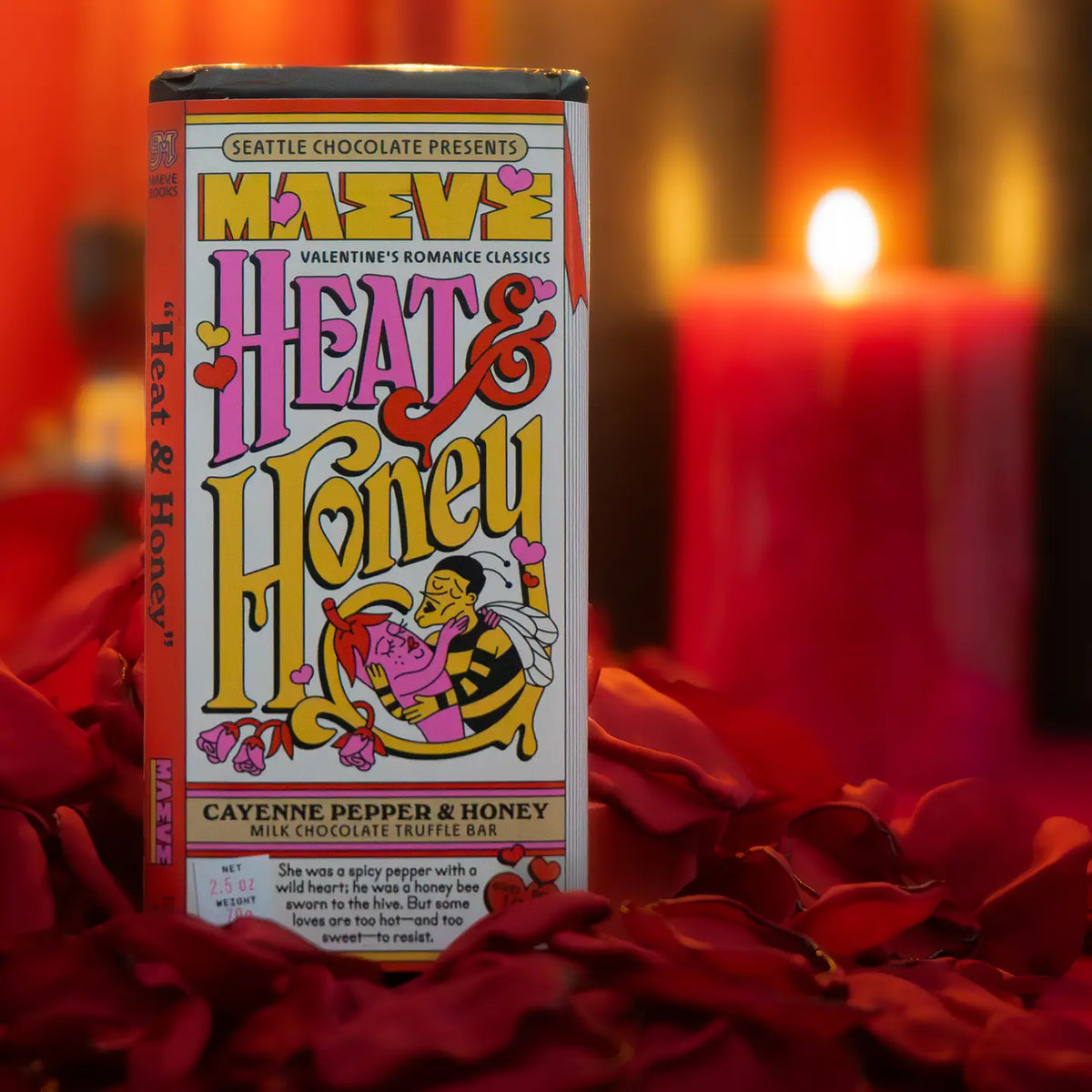 Heat & Honey' chocolate bar with a candle and red flowers in the background