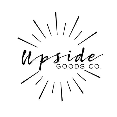 Black hand-drawn style logo text reading 'Upside Goods Co.' with radiating line accents on a white background.