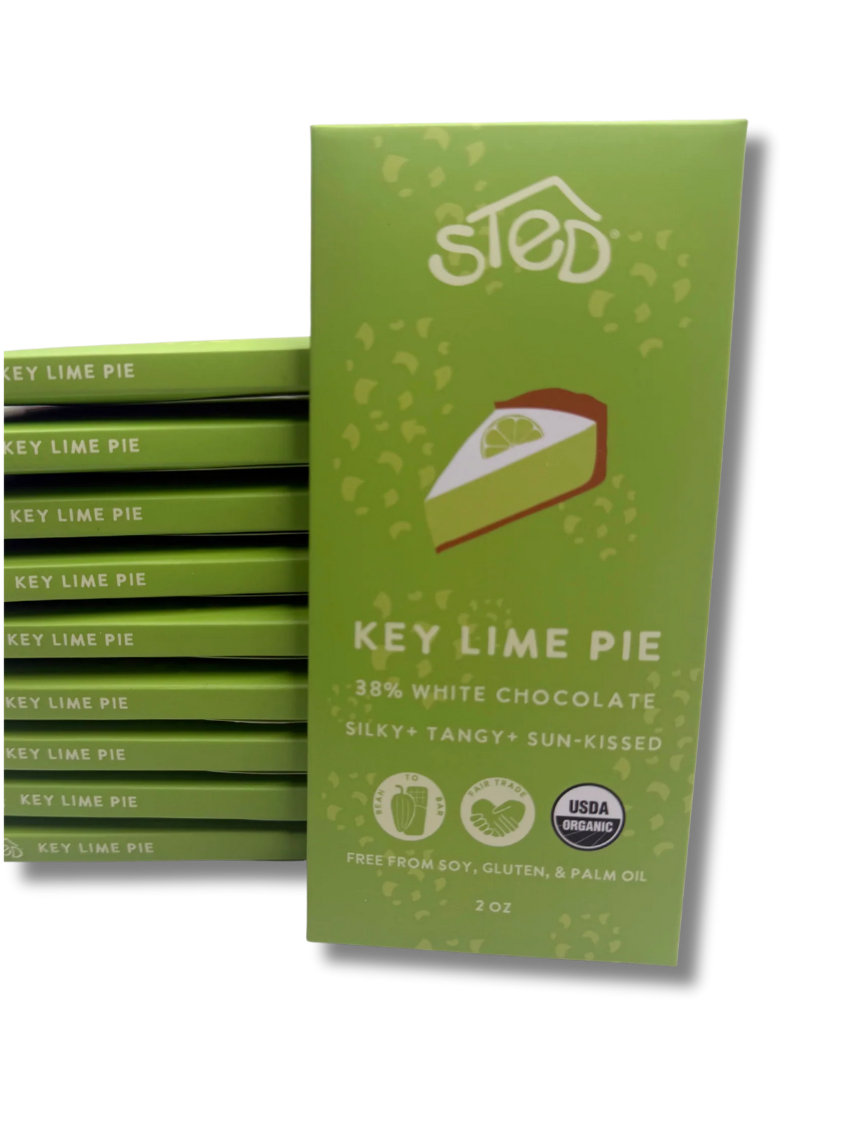 A green chocolate bar package labeled 'sted' and 'Key Lime Pie' stands upright in front of a stack of matching wrapped bars on a white background.