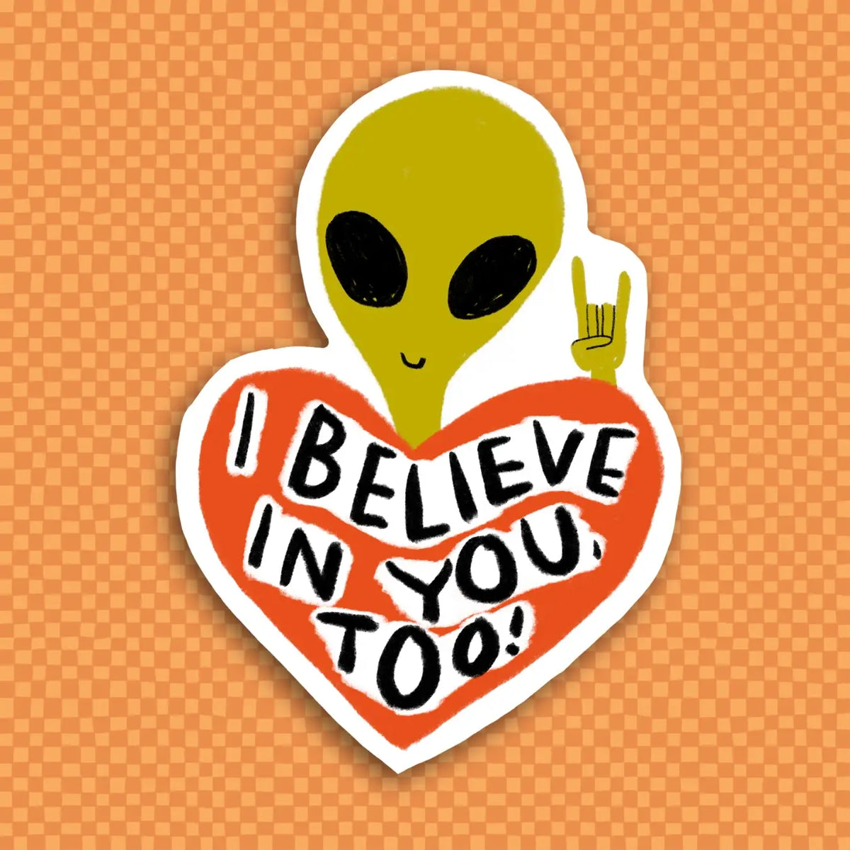 Sticker of an alien on a heart with 'I believe in you, too!' text on an orange background