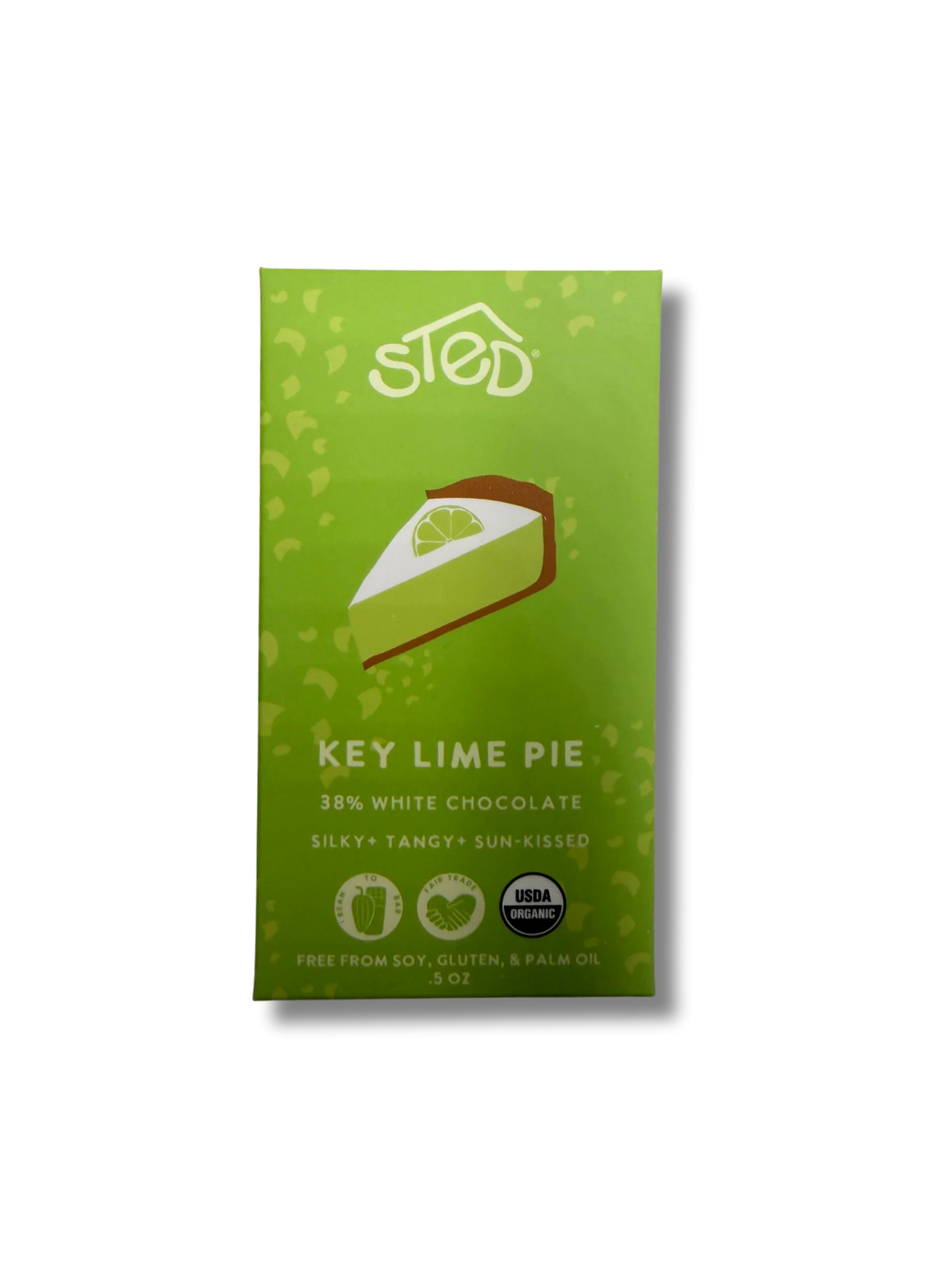 A green package of Sled Key Lime Pie chocolate, featuring a slice of lime pie illustration and text indicating 38% white chocolate.