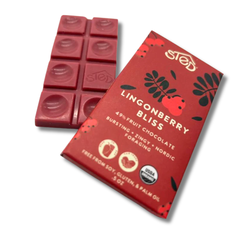 Red chocolate bar with 'STED' branding and 'Lingonberry Bliss' flavor on a white background