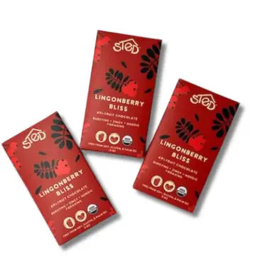 Three red packages of Lingonberry Bliss chocolate bars on a white background