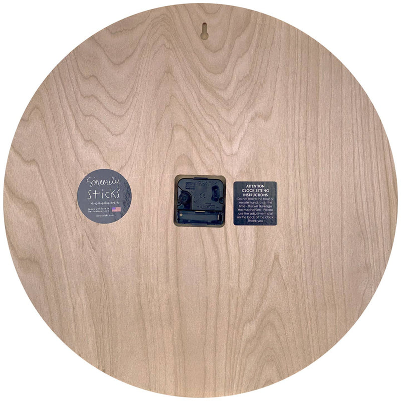 Wooden disc with a central hole and labels on a white background