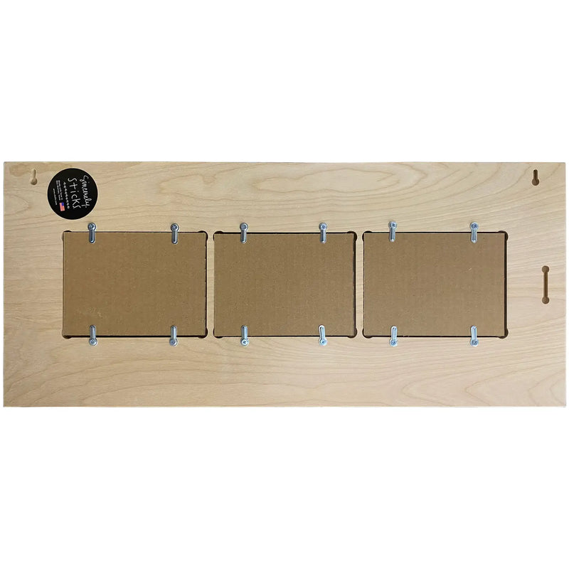 Wooden board with three cardboard panels and clips on a white background