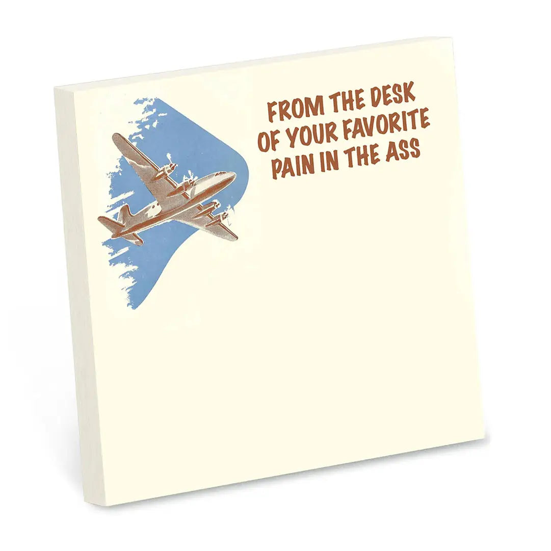 Note pad with airplane illustration and humorous text on a white background