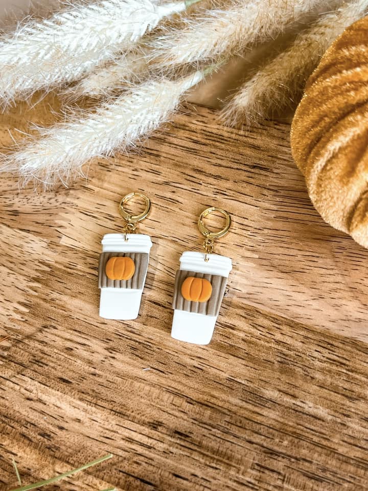 Polymer Clay Earrings in the shape of a to go coffee cup with a pumpkin on the sleeve 