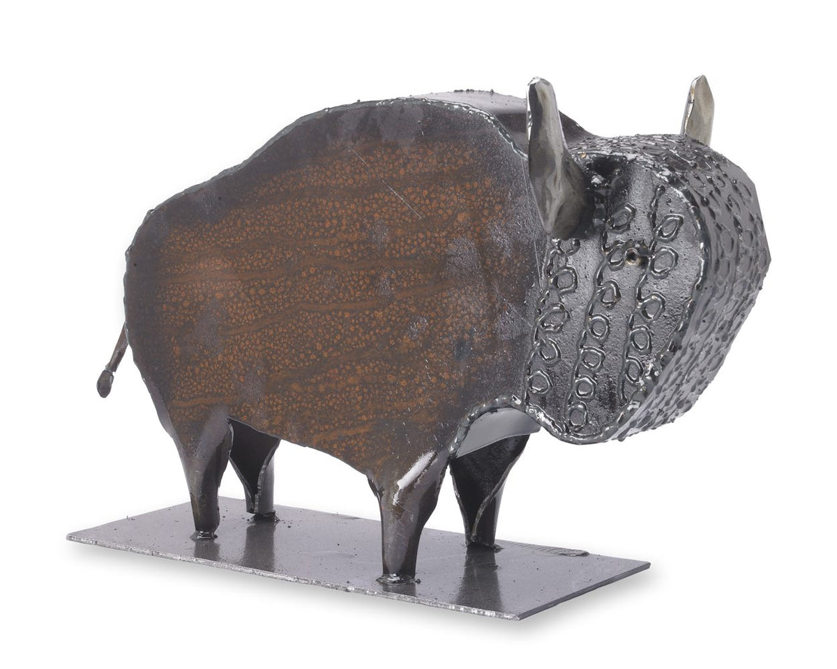 A rustic metal bison sculpture standing on a rectangular metal base, photographed against a plain white background.