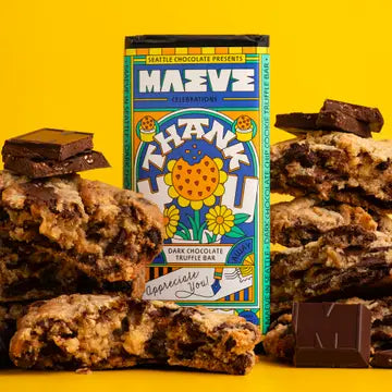 Maeve chocolate bar packaging with truffles on a yellow background