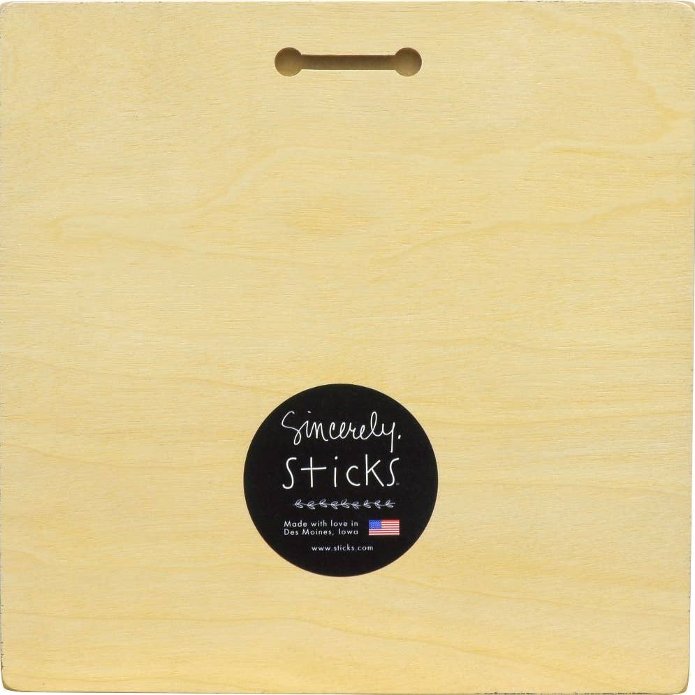 A square light wood box or board with a hanging hole at the top and a round black sticker reading 'Sincerely Sticks' on the front.