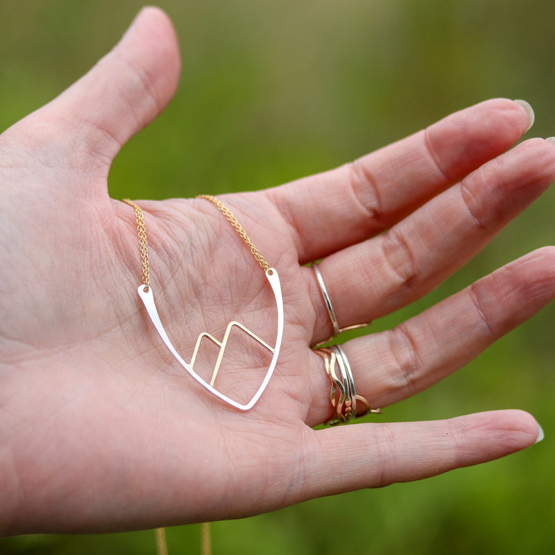 Mountain Necklace resting in an open hand
