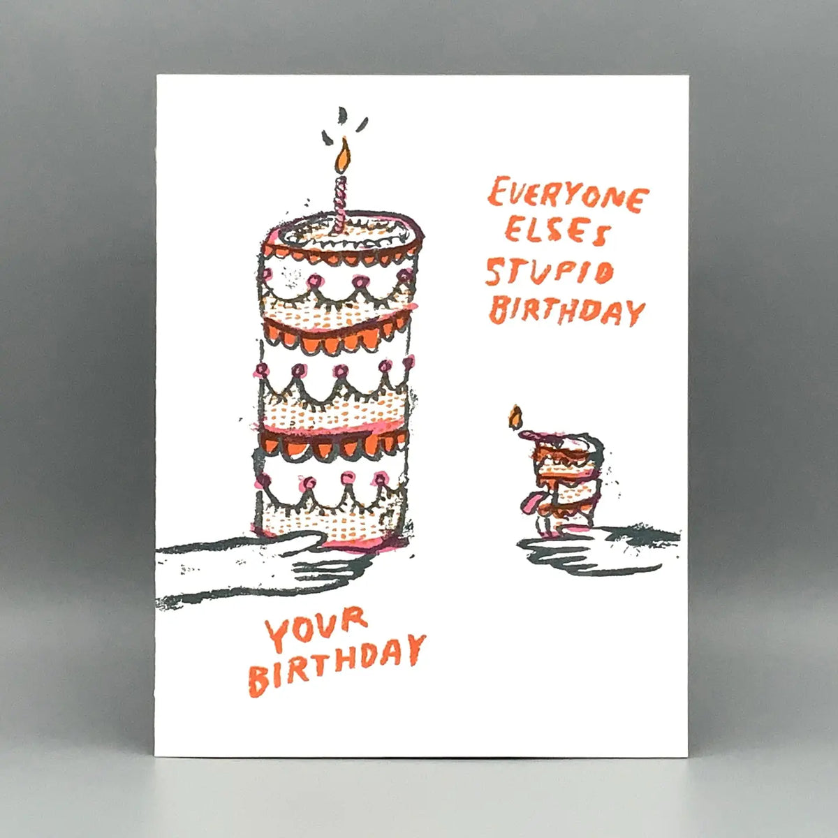 Birthday card with a cake illustration and humorous text on a gray background