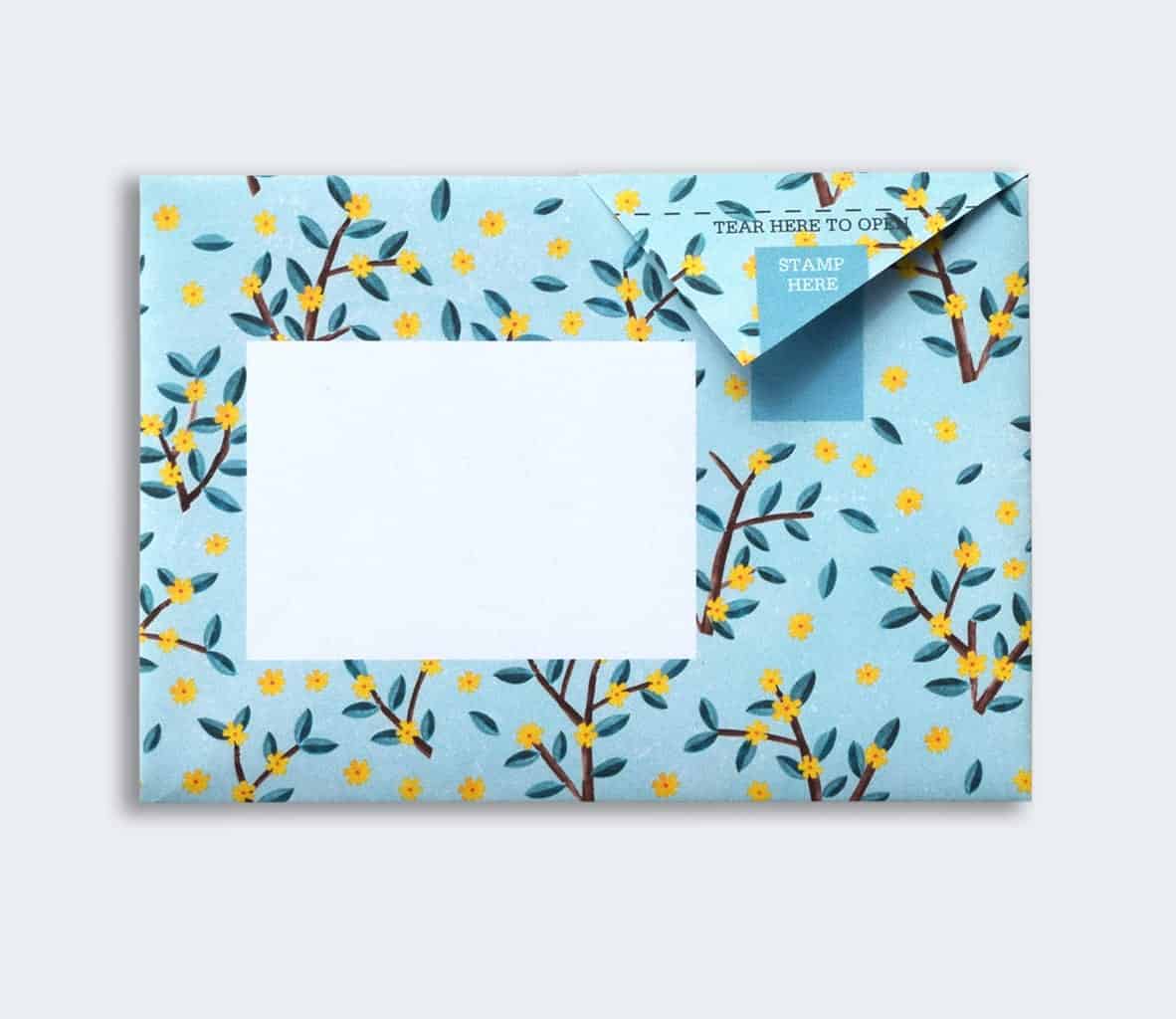 Decorative envelope with floral pattern on a light blue background