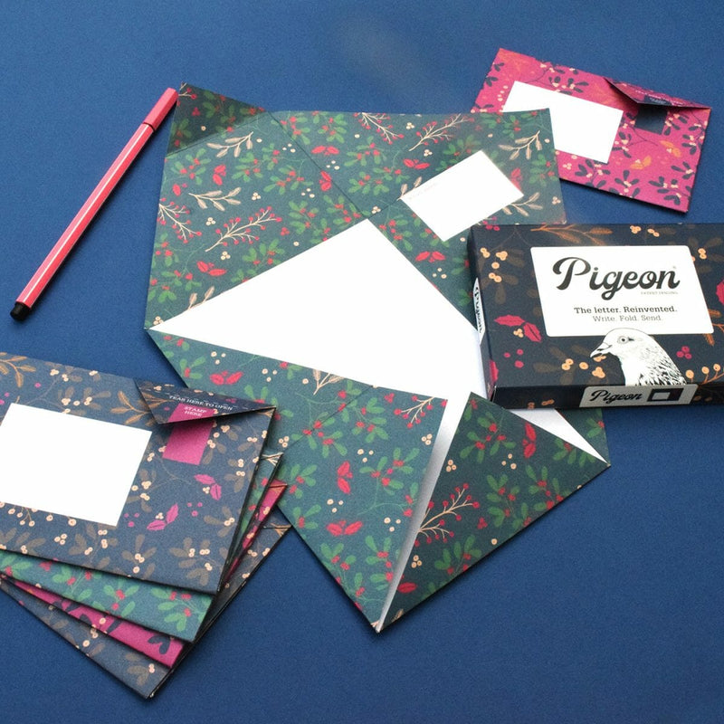 Floral patterned cards and envelopes with a box labeled 'Pigeon' on a blue background