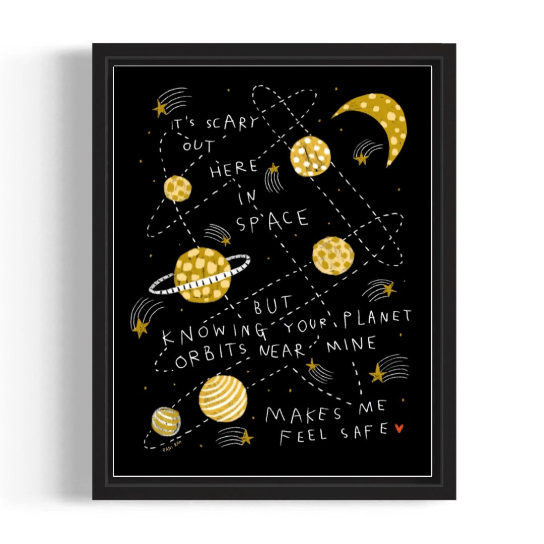 Framed artwork with space-themed design and text on a black background