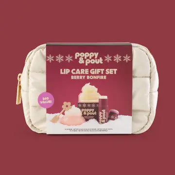 Poppy & Pout Lip Care Gift Set Berry Bonfire, featuring a cream-colored puffer pouch with a gold zipper and a maroon paper label displaying product illustrations and branding.