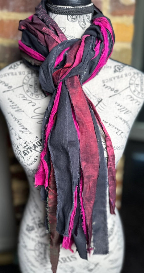 Mannequin wearing a colorful scarf with a blurred background