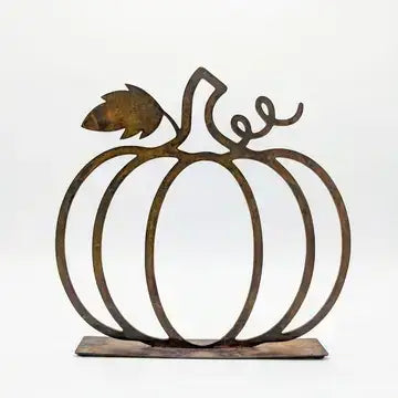 Rustic metal pumpkin wall decor sculpture with a leaf and curling stem, mounted on a rectangular base against a plain white background.