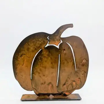 A rustic metal pumpkin-shaped decorative sculpture with a textured, weathered copper-brown finish, standing on a rectangular base against a plain white background.