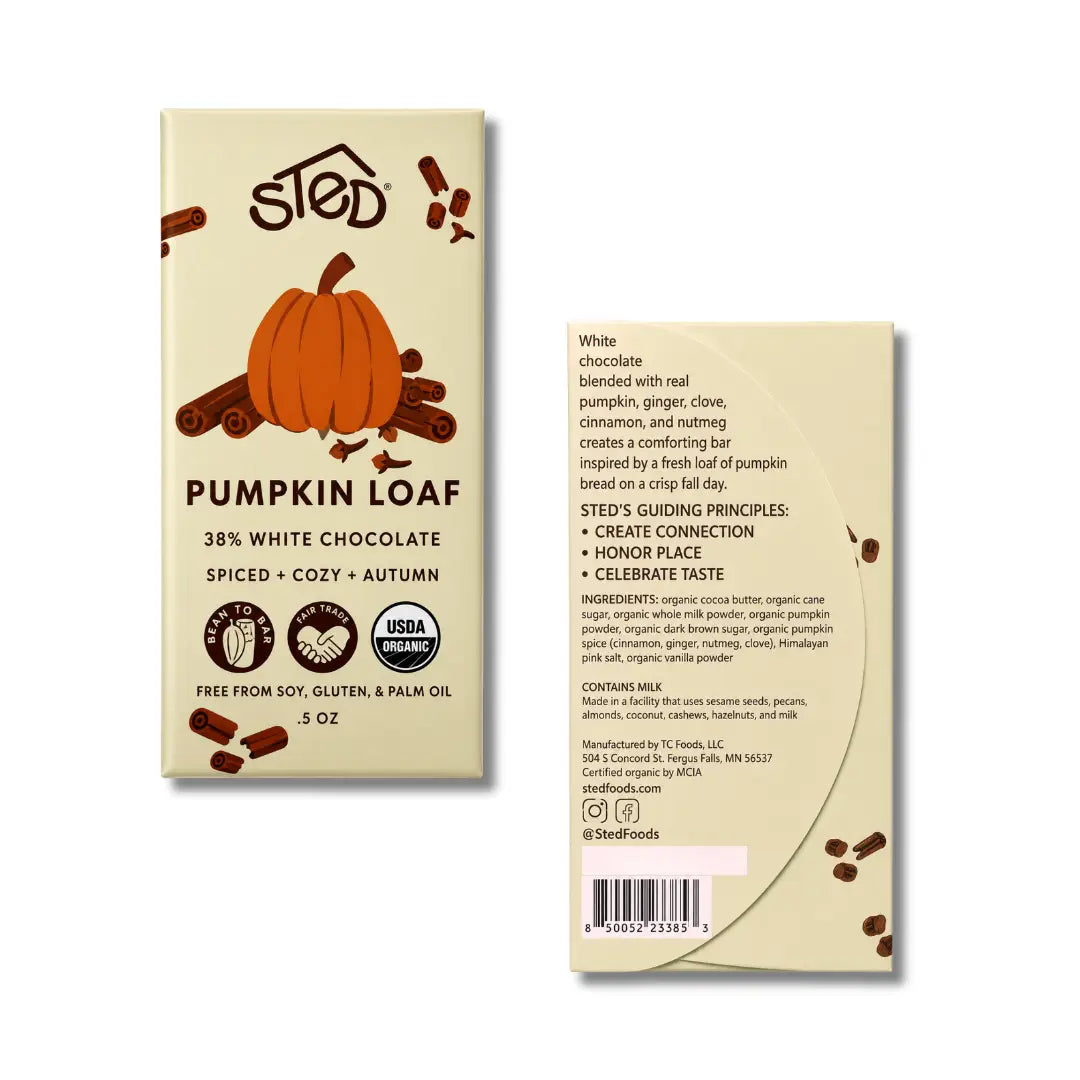 Front and back views of a Sted Pumpkin Loaf chocolate bar package on a white background. The front shows a cream-colored wrapper with an orange pumpkin illustration, chocolate pieces, and the Sted logo.