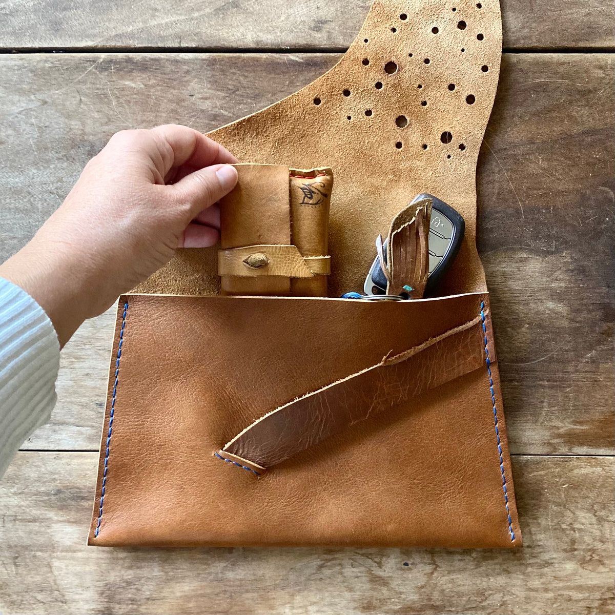 Clutch with keys and wallet to show size 