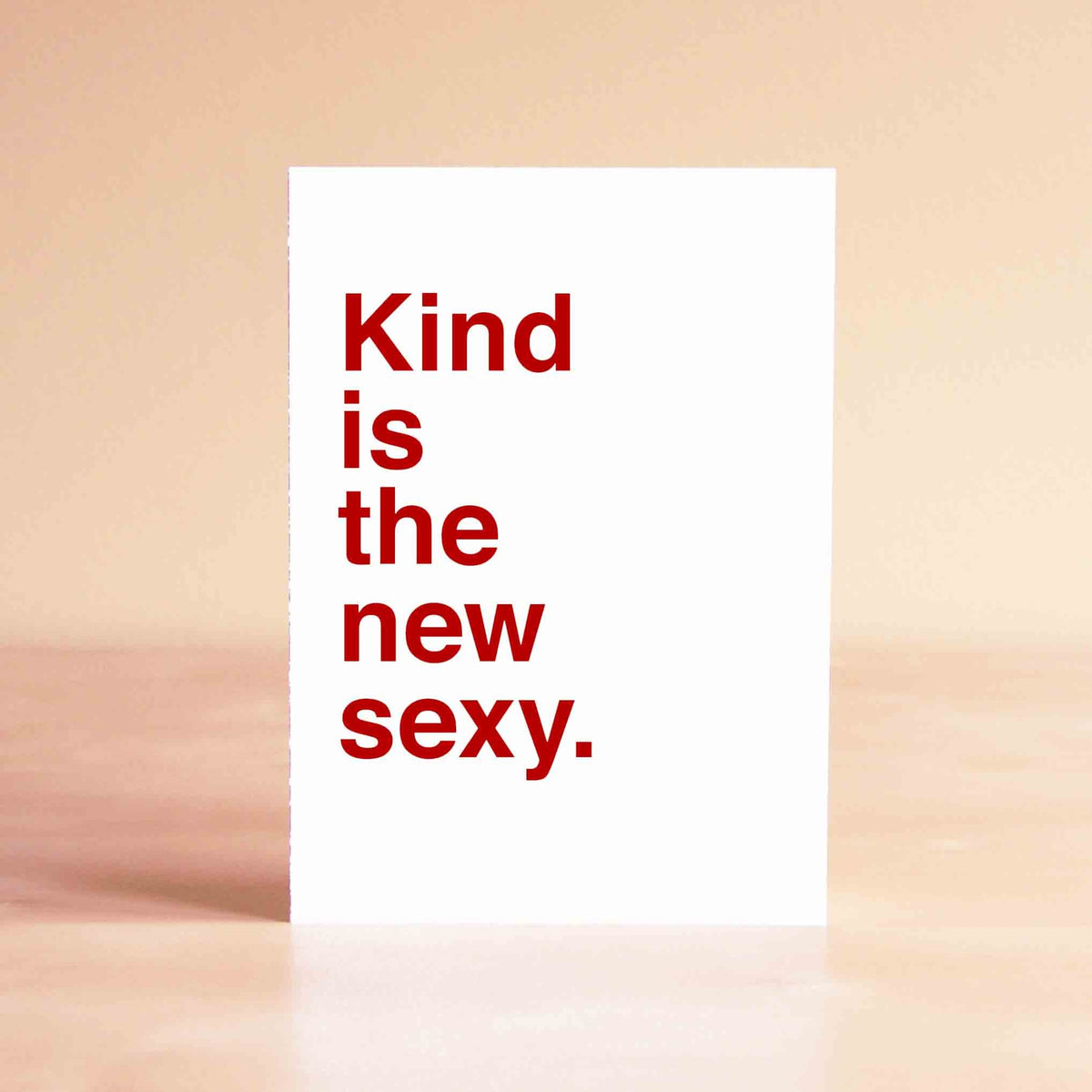 White card with red lettering reading "Kind is the new sexy."