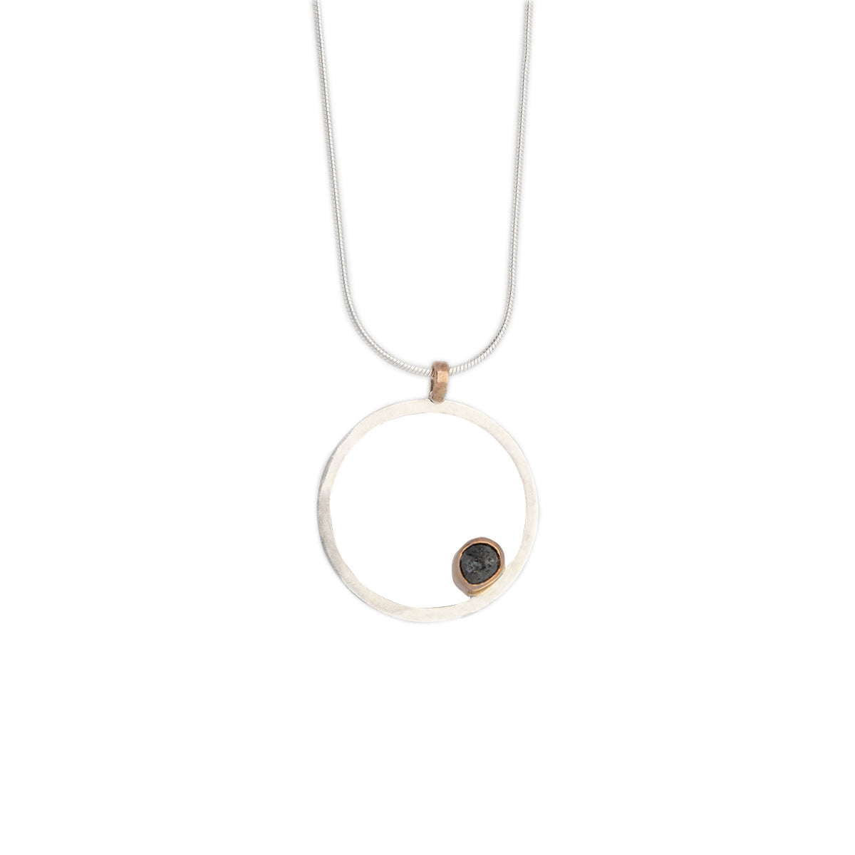 Mini .75" in Diameter Hollow Sterling Silver Circle Pendant with an off center 14k rose gold bezel for a grey rough diamond shard, rose gold bale and sterling silver chain on with background