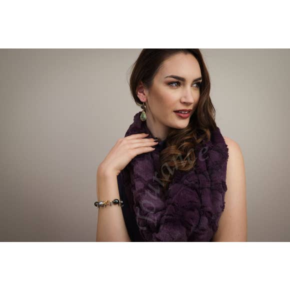 Model of the Infinity Scarf in the Moroccan Plum color variation.