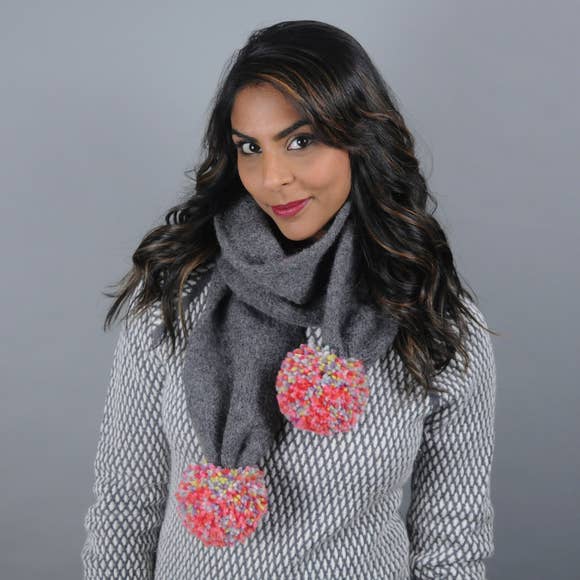 Secondary Model of a Dark Grey Scarf with Giant Multi-Colored Poms.