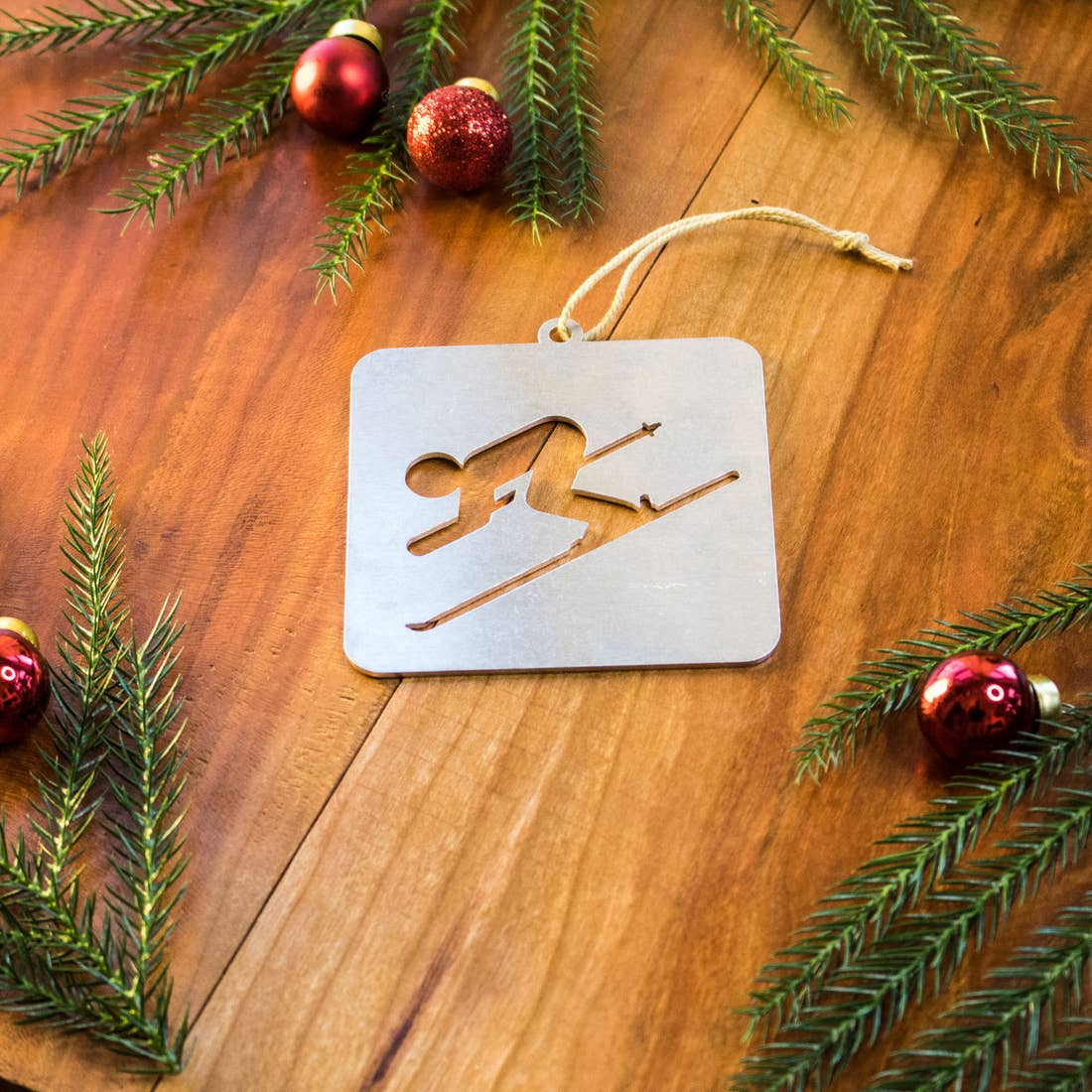 Square Aluminum Ornament with a Downhill Skier laser cut into it