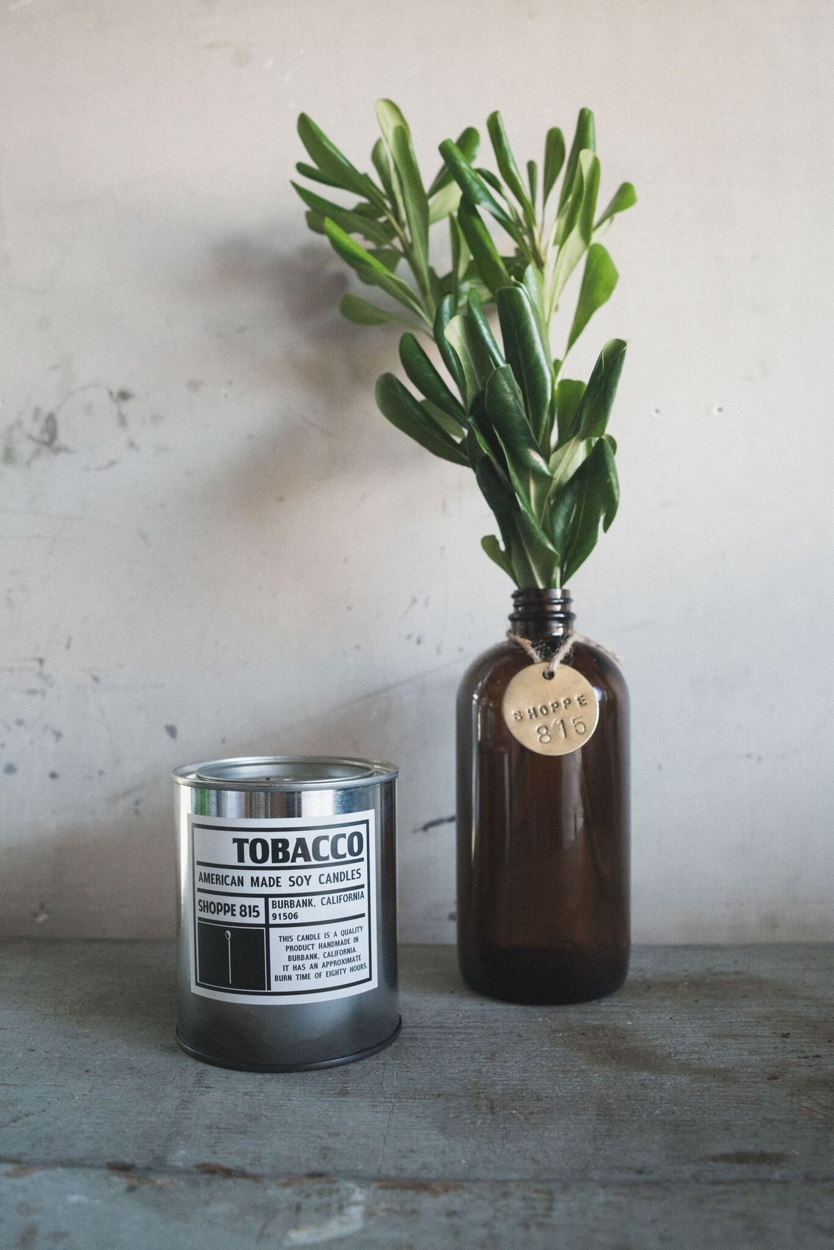 Tobacco Soy Candle in a Tin Can with Glass Bottle and Plant for Decor