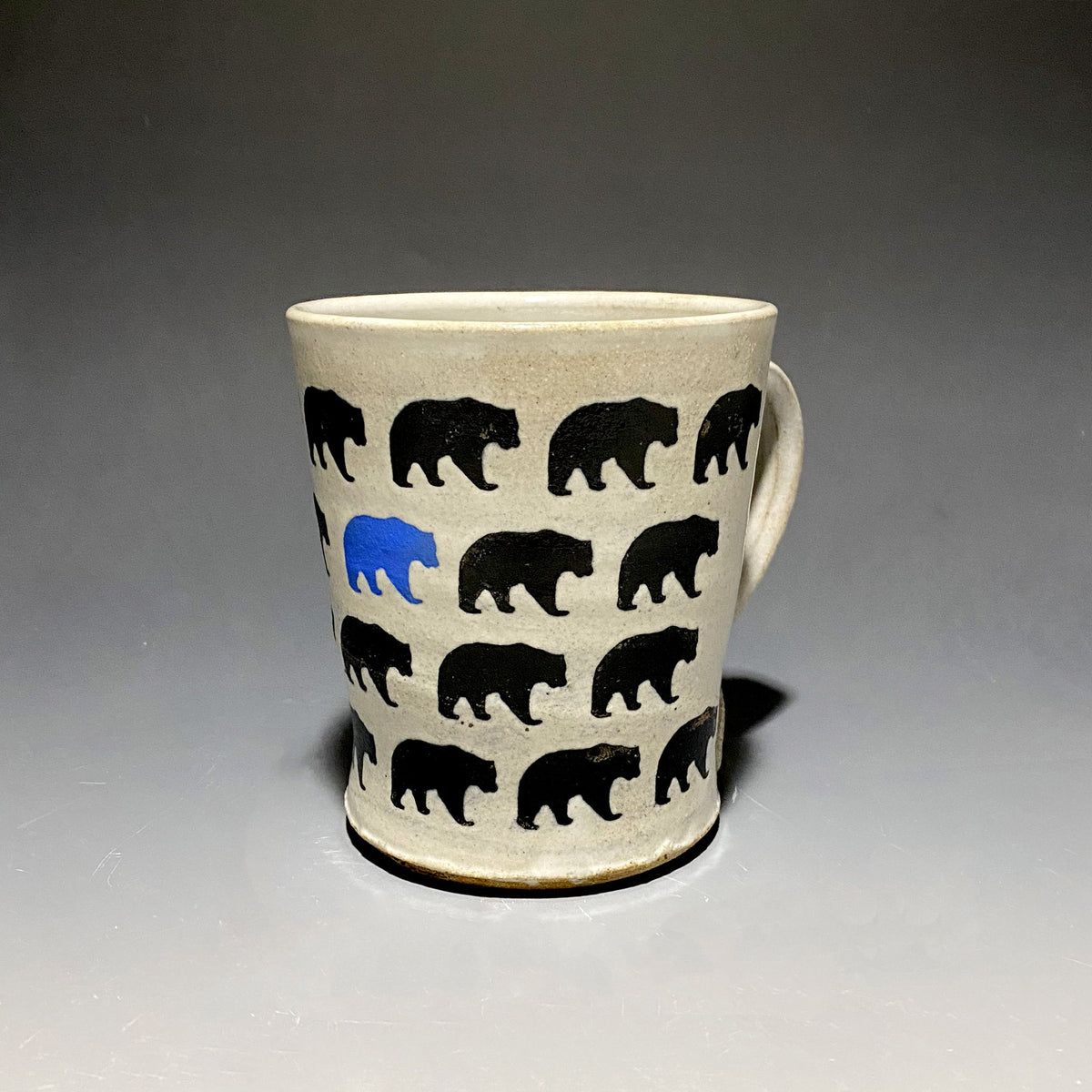 15oz Ceramic Mug featuring repeating black bears and one blue bear