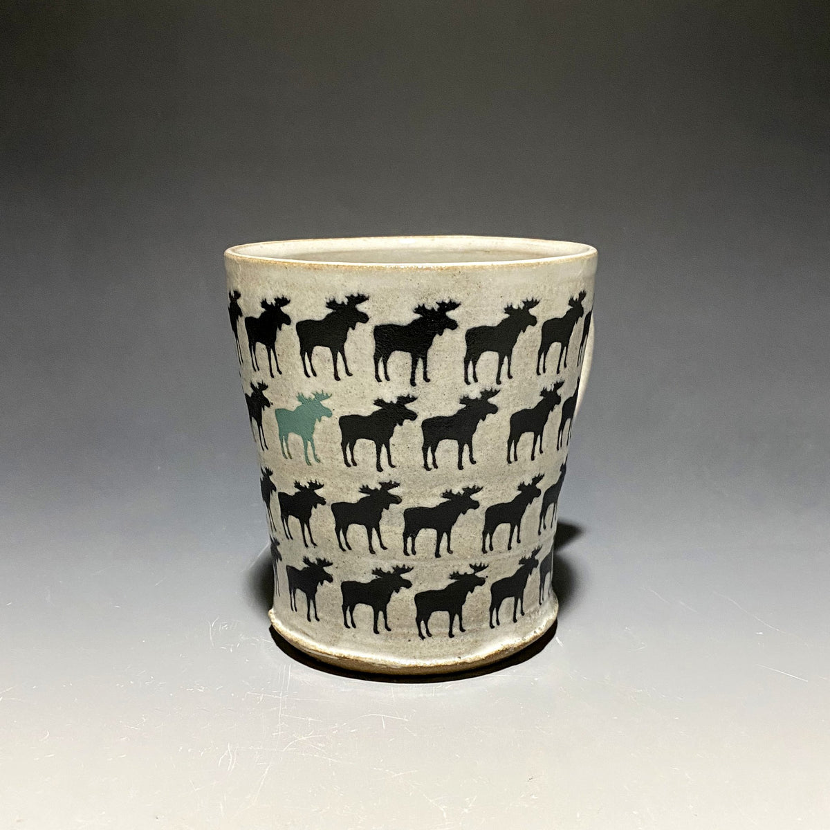 15oz Ceramic Mug featuring repeating black moose and one blue bear